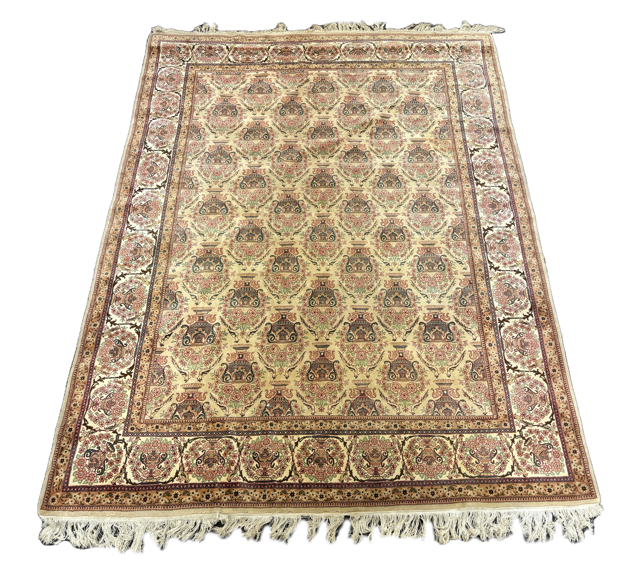 A North West Persian ivory ground carpet, woven with rows of flowering urns, 400 x 298cm